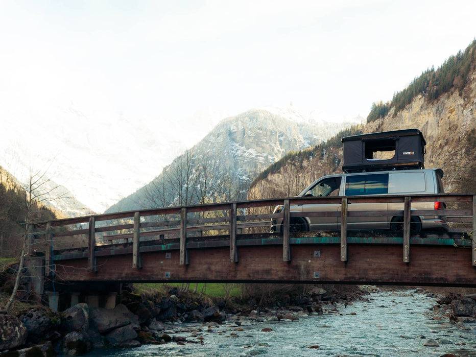 TentBox Classic roof tent in camping on bridge in mountainous region